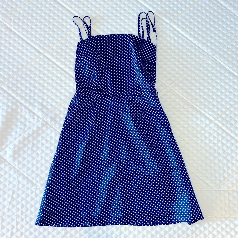 Navy/white polka dot mini dress,  criss cross lacing and ties in back